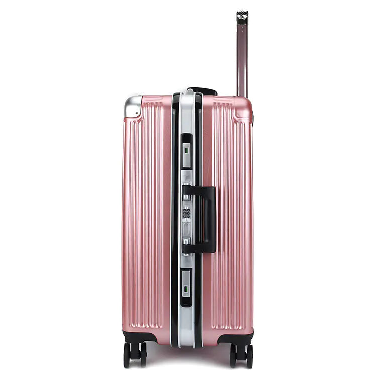 Latch side of pink suitcase with black handle and wheels on a white background