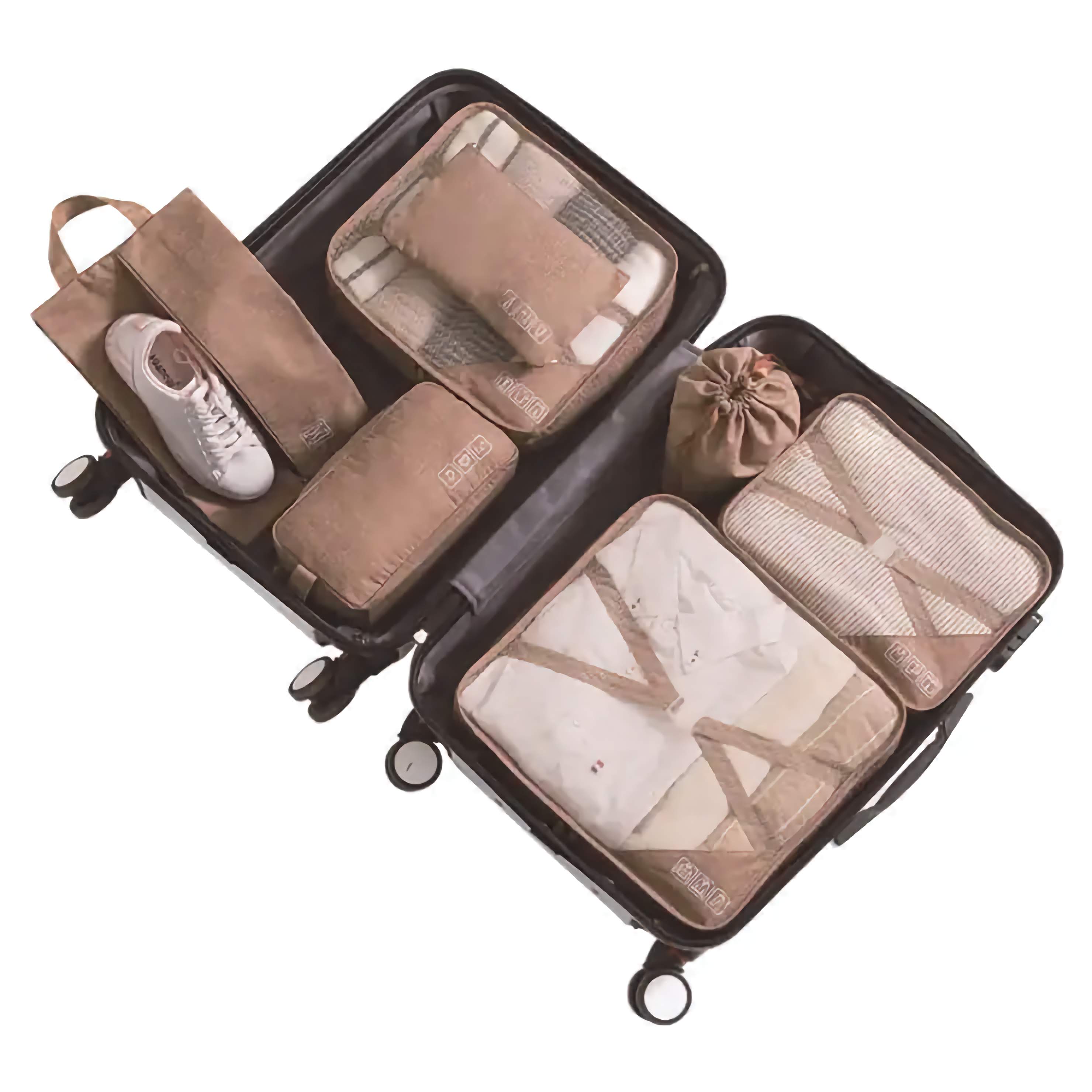 Set of tan travel packing cubes with a suitcase on a white background