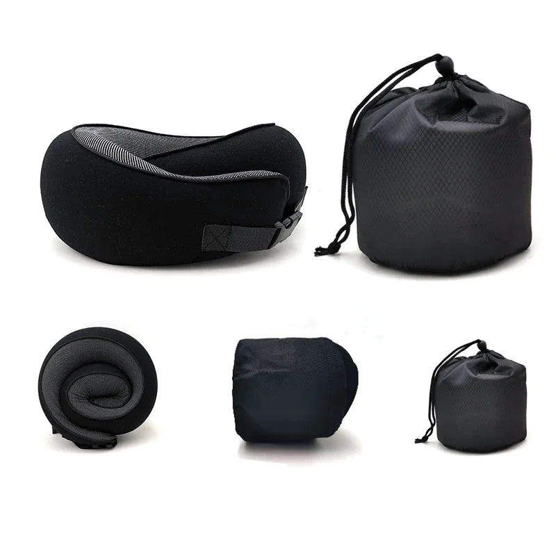 Black travel pillow and accessories on a white background