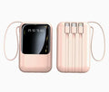 Rose gold power bank with digital display and multiple ports on a white background
