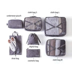Set of gray packing cubes with name labels on a white background