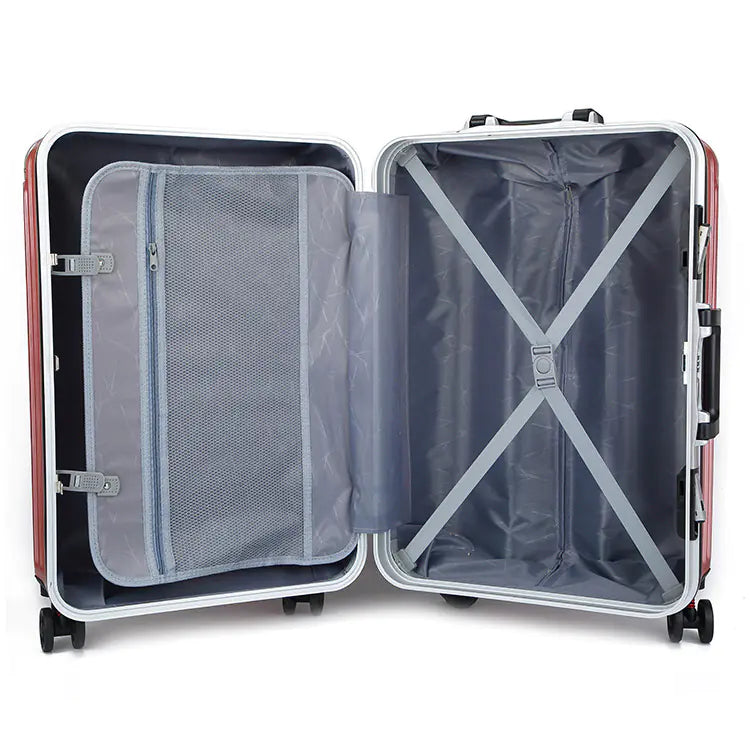 Open suitcase with clear interior compartments on a white background